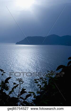 Silhouette of a mountain at the seaside, Italian Riviera, Cinque Terre National Park, Mar Ligure, Cinque Terre, La Spezia, Liguria, Italy View Large Photo Image Stock Photo - Silhouette of a mountain at the seaside, Italian Riviera, Cinque Terre National Park, Mar Ligure, Cinque Terre, La Spezia, Liguria, Italy. Fotosearch