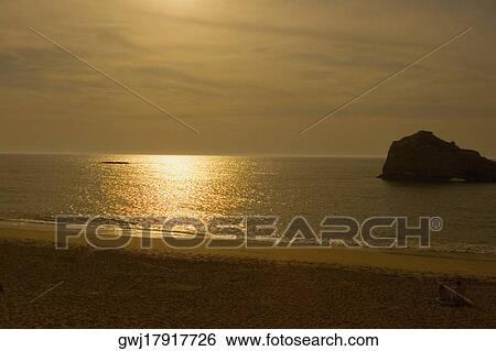 Silhouette of rock formation in the sea at dusk, Biarritz, Basque Country, Pyrenees-Atlantiques, Aquitaine, France View Large Photo Image Stock Photograph - Silhouette of rock formation in the sea at dusk, Biarritz, Basque Country, Pyrenees-Atlantiques, Aquitaine, France. Fotosearch