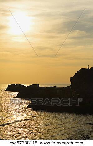 Silhouette of rocks in the ocean, Baie de Biarritz, Biarritz, France View Large Photo Image Stock Photo - Silhouette of rocks in the ocean, Baie de Biarritz, Biarritz, France. Fotosearch