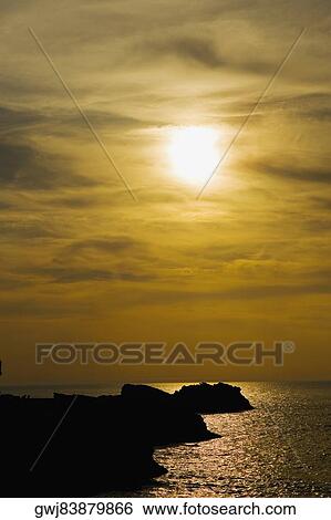 Silhouette of rocks in the ocean, Baie de Biarritz, Biarritz, France View Large Photo Image Stock Photograph - Silhouette of rocks in the ocean, Baie de Biarritz, Biarritz, France. Fotosearch