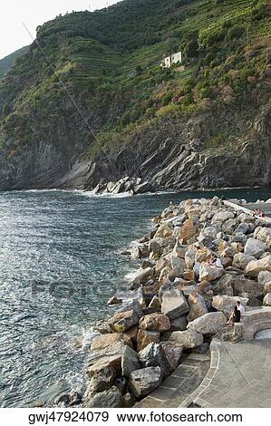 Stones at a riverside, Italian Riviera, Cinque Terre National Park, Vernazza, La Spezia, Liguria, Italy View Large Photo Image Stock Photo - Stones at a riverside, Italian Riviera, Cinque Terre National Park, Vernazza, La Spezia, Liguria, Italy. Fotosearch