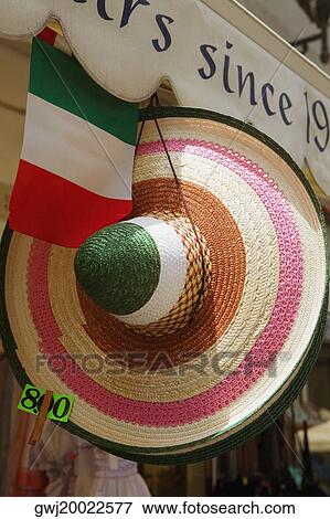 Sun hat hanging at a market stall, Sorrento, Sorrentine Peninsula, Naples Province, Campania, Italy View Large Photo Image Stock Photo - Sun hat hanging at a market stall, Sorrento, Sorrentine Peninsula, Naples Province, Campania, Italy. Fotosearch