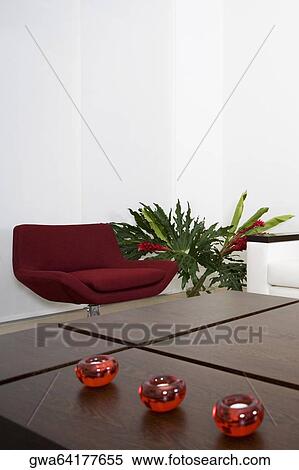 Table and a couch in a living room View Large Photo Image Stock Photography - Table and a couch in a living room. Fotosearch
