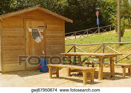 Table and benches in front of a log cabin, Siena Province, Tuscany, Italy View Large Photo Image Picture - Table and benches in front of a log cabin, Siena Province, Tuscany, Italy. Fotosearch