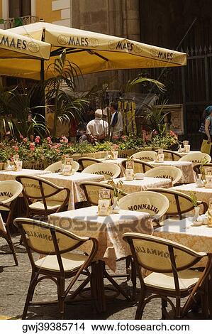 Tables and chairs at a sidewalk cafe, Via Padre Reginaldo Giuliani, Sorrento, Sorrentine Peninsula, Naples Province, Campania, Italy View Large Photo Image Picture - Tables and chairs at a sidewalk cafe, Via Padre Reginaldo Giuliani, Sorrento, Sorrentine Peninsula, Naples Province, Campania, Italy. Fotosearch