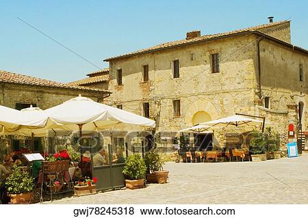 Tables and chairs at a sidewalk cafe, Piazza Roma, Monteriggioni, Siena Province, Tuscany, Italy View Large Photo Image Stock Photo - Tables and chairs at a sidewalk cafe, Piazza Roma, Monteriggioni, Siena Province, Tuscany, Italy. Fotosearch