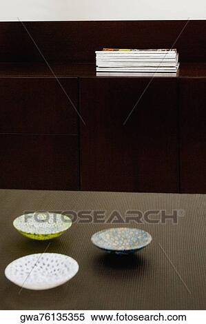 Three ceramic bowls on a table View Large Photo Image Stock Photography - Three ceramic bowls on a table. Fotosearch