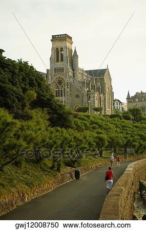 Three people walking on the road, Eglise Sainte Eugenie, Biarritz, France View Large Photo Image Stock Image - Three people walking on the road, Eglise Sainte Eugenie, Biarritz, France. Fotosearch