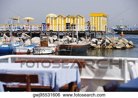 Tourist resorts at a harbor, Marina Grande, Capri, Sorrento, Sorrentine Peninsula, Naples Province, Campania, Italy View Large Photo Image Stock Photograph - Tourist resorts at a harbor, Marina Grande, Capri, Sorrento, Sorrentine Peninsula, Naples Province, Campania, Italy. Fotosearch