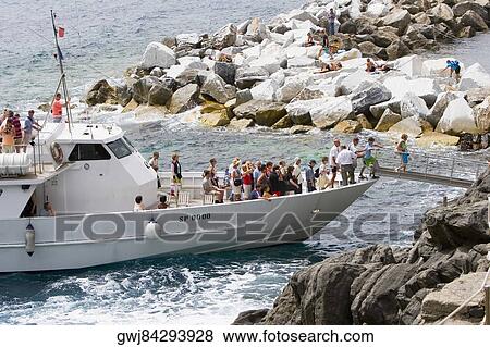 Tourists on a ferry, Italian Riviera, Cinque Terre, La Spezia, Liguria, Italy View Large Photo Image Stock Photo - Tourists on a ferry, Italian Riviera, Cinque Terre, La Spezia, Liguria, Italy. Fotosearch