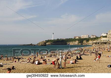 Tourists on the beach, Grande Plage, Phare de Biarritz, Biarritz, France View Large Photo Image Stock Image - Tourists on the beach, Grande Plage, Phare de Biarritz, Biarritz, France. Fotosearch