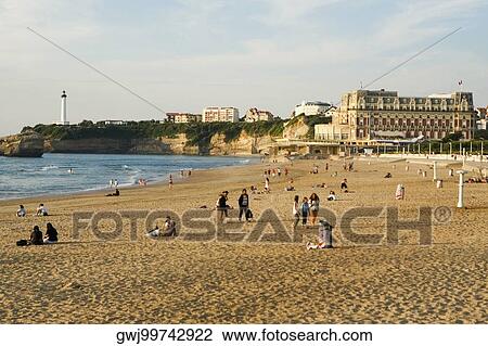Tourists on the beach, Phare de Biarritz, Hotel du Palais, Grande Plage, Biarritz, France View Large Photo Image Stock Image - Tourists on the beach, Phare de Biarritz, Hotel du Palais, Grande Plage, Biarritz, France. Fotosearch