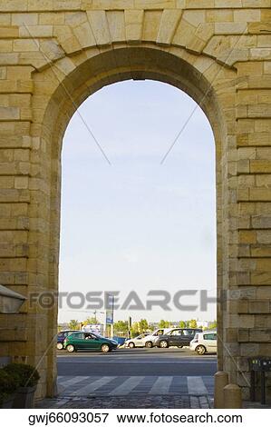Traffic on road viewed through an arch, Porte de la Monnaie, Vieux Bordeaux, Bordeaux, France View Large Photo Image Stock Photo - Traffic on road viewed through an arch, Porte de la Monnaie, Vieux Bordeaux, Bordeaux, France. Fotosearch