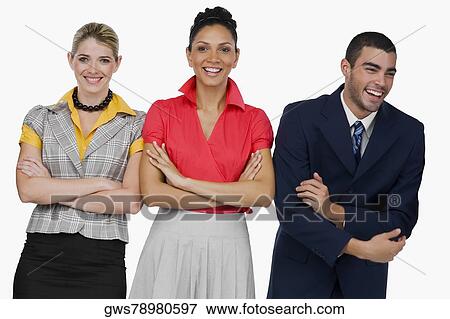 Two businesswomen and a businessman standing with their arms crossed and smiling View Large Photo Image Stock Photo - Two businesswomen and a businessman standing with their arms crossed and smiling. Fotosearch