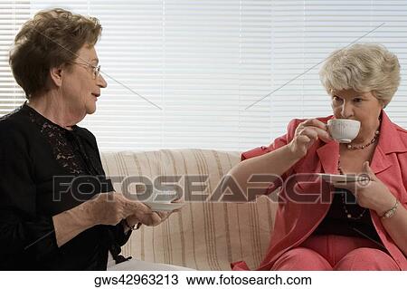 Two senior women having tea View Large Photo Image Stock Image - Two senior women having tea. Fotosearch