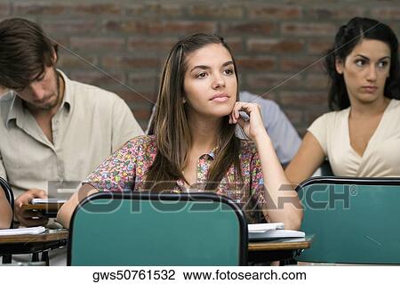 University students sitting in a classroom View Large Photo Image Stock Image - University students sitting in a classroom. Fotosearch