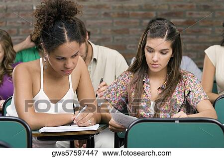 Stock Photo - University students studying in a classroom. Fotosearch