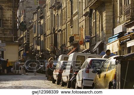 Vehicles in a street, Quartier St. Michel, Vieux Bordeaux, Bordeaux, France View Large Photo Image Stock Photo - Vehicles in a street, Quartier St. Michel, Vieux Bordeaux, Bordeaux, France. Fotosearch