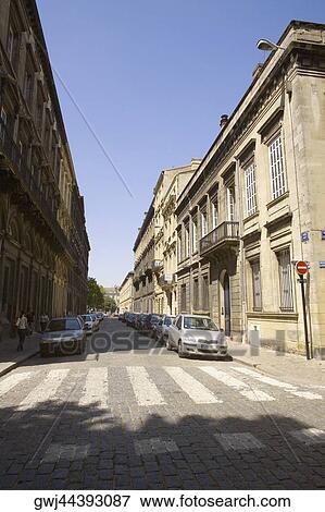 Stock Photo - Vehicles parked on the both sides of a road, Rue Ferrere, Bordeaux, France. Fotosearch