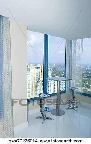 Picture - View of a city through the window of a hotel. Fotosearch
