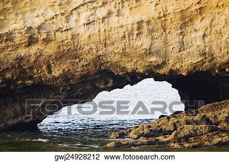 Water flowing through natural arch, Biarritz, Basque Country, Pyrenees-Atlantiques, Aquitaine, France View Large Photo Image Stock Image - Water flowing through natural arch, Biarritz, Basque Country, Pyrenees-Atlantiques, Aquitaine, France. Fotosearch