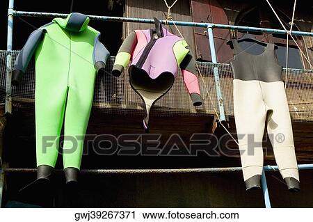 Wetsuits hanging on a pipe, Cinque Terre National Park, RioMaggiore, Cinque Terre, La Spezia, Liguria, Italy View Large Photo Image Stock Image - Wetsuits hanging on a pipe, Cinque Terre National Park, RioMaggiore, Cinque Terre, La Spezia, Liguria, Italy. Fotosearch