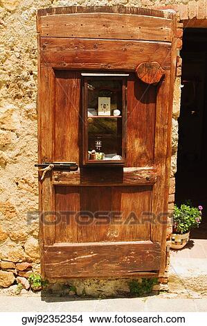 Wooden door of a house, Monteriggioni, Siena Province, Tuscany, Italy View Large Photo Image Picture - Wooden door of a house, Monteriggioni, Siena Province, Tuscany, Italy. Fotosearch