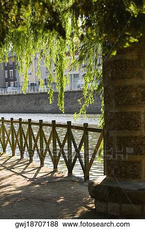 Wooden fence at the riverside, Sarthe River, Pont Yssoir, Le Mans, Sarthe, France View Large Photo Image Stock Photo - Wooden fence at the riverside, Sarthe River, Pont Yssoir, Le Mans, Sarthe, France. Fotosearch