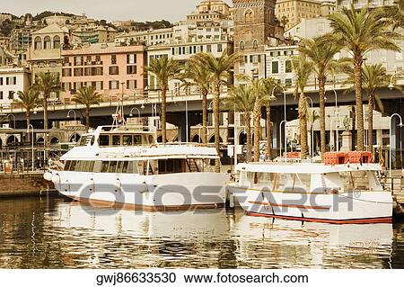 Stock Image - Yachts docked at a harbor, Porto Antico, Genoa, Italy. Fotosearch