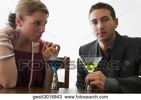 Young couple drinking cocktail View Large Photo Image Stock Image - Young couple drinking cocktail. Fotosearch