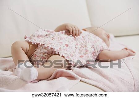 Close-up of a baby girl sleeping View Large Photo Image Stock Image - Close-up of a baby girl sleeping. Fotosearch