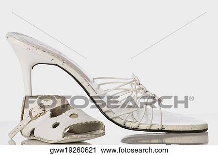 Close-up of a baby sandal with a high heel shoe View Large Photo Image Stock Image - Close-up of a baby sandal with a high heel shoe. Fotosearch