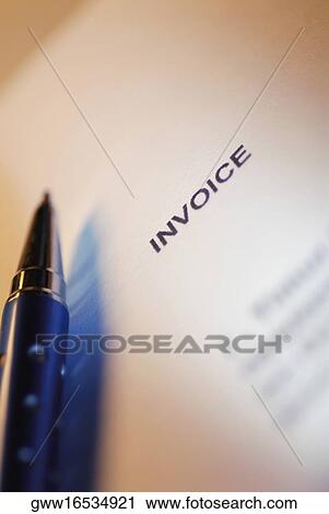 Stock Image - Close-up of a ballpoint pen on a bill. Fotosearch