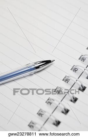 Close-up of a ballpoint pen on a spiral notebook View Large Photo Image Stock Image - Close-up of a ballpoint pen on a spiral notebook. Fotosearch