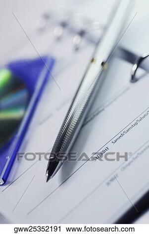 Close-up of a ballpoint pen on a personal organizer View Large Photo Image Stock Image - Close-up of a ballpoint pen on a personal organizer. Fotosearch