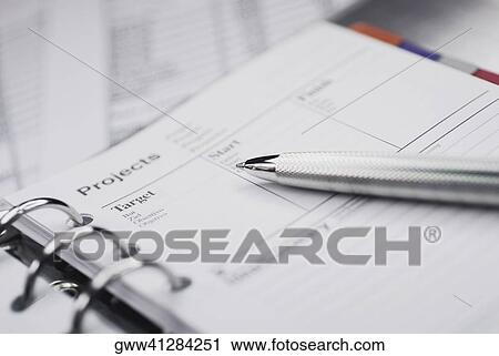 Close-up of a ballpoint pen on a personal organizer View Large Photo Image Stock Image - Close-up of a ballpoint pen on a personal organizer. Fotosearch