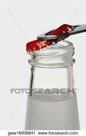 Close-up of a bottle with an opener View Large Photo Image Stock Image - Close-up of a bottle with an opener. Fotosearch