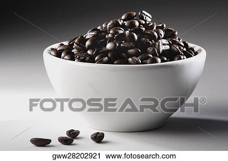 Close-up of a bowl full of coffee beans View Large Photo Image Stock Image - Close-up of a bowl full of coffee beans. Fotosearch