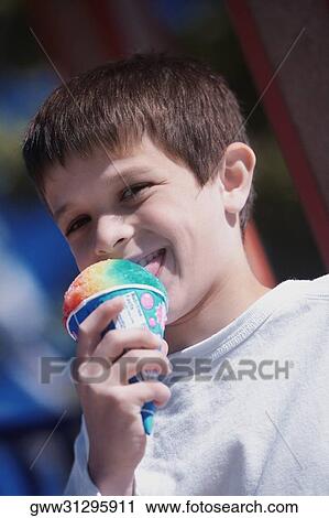 Close-up of a boy licking an ice-cream View Large Photo Image Stock Image - Close-up of a boy licking an ice-cream. Fotosearch