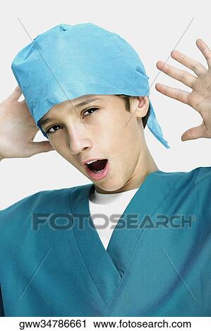 Close-up of a boy wearing surgical scrubs and yawning View Large Photo Image Stock Image - Close-up of a boy wearing surgical scrubs and yawning. Fotosearch