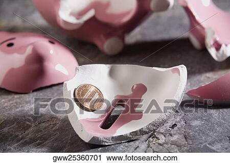 Close-up of a broken piggy bank with a coin View Large Photo Image Stock Image - Close-up of a broken piggy bank with a coin. Fotosearch
