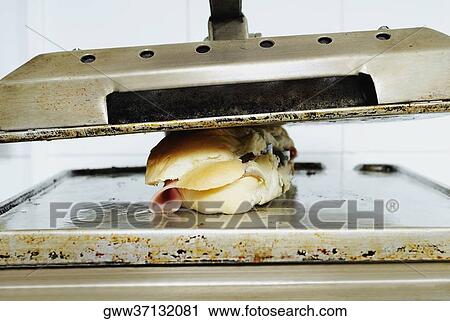 Close-up of a bun in a toaster View Large Photo Image Stock Image - Close-up of a bun in a toaster. Fotosearch