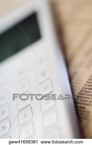 Close-up of a calculator on a financial newspaper View Large Photo Image Stock Image - Close-up of a calculator on a financial newspaper. Fotosearch