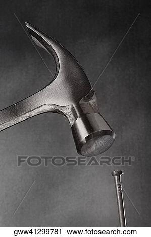 Close-up of a claw hammer hitting a nail View Large Photo Image Stock Image - Close-up of a claw hammer hitting a nail. Fotosearch
