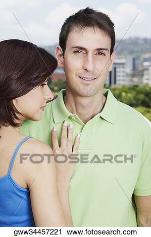 Stock Image - Close-up of a couple standing together. Fotosearch