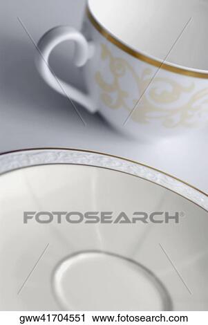 Stock Image - Close-up of a cup and a saucer. Fotosearch