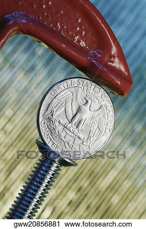 Close-up of a dollar coin in a wrench View Large Photo Image Stock Image - Close-up of a dollar coin in a wrench. Fotosearch
