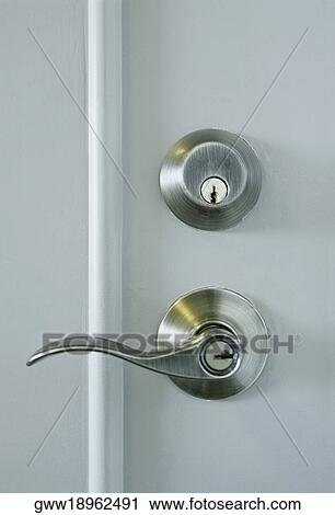 Close-up of a door handle and a lock View Large Photo Image Stock Image - Close-up of a door handle and a lock. Fotosearch