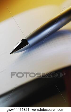 Stock Image - Close-up of a fountain pen on a sheet of paper. Fotosearch