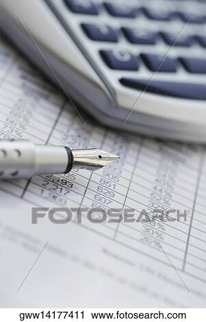 Close-up of a fountain pen with a calculator on financial report View Large Photo Image Stock Image - Close-up of a fountain pen with a calculator on financial report. Fotosearch